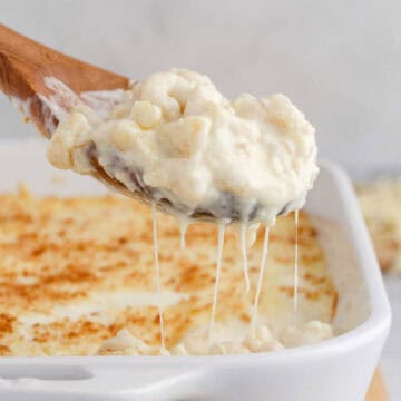 Baked White Cheddar Mac and Cheese Being Spooned Out