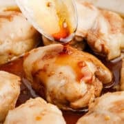 Chicken Thighs with Honey Sauce Being Spooned Over