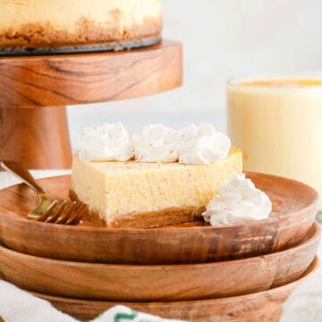 Eggnog Cheesecake Slice With Whipped Cream and Fork