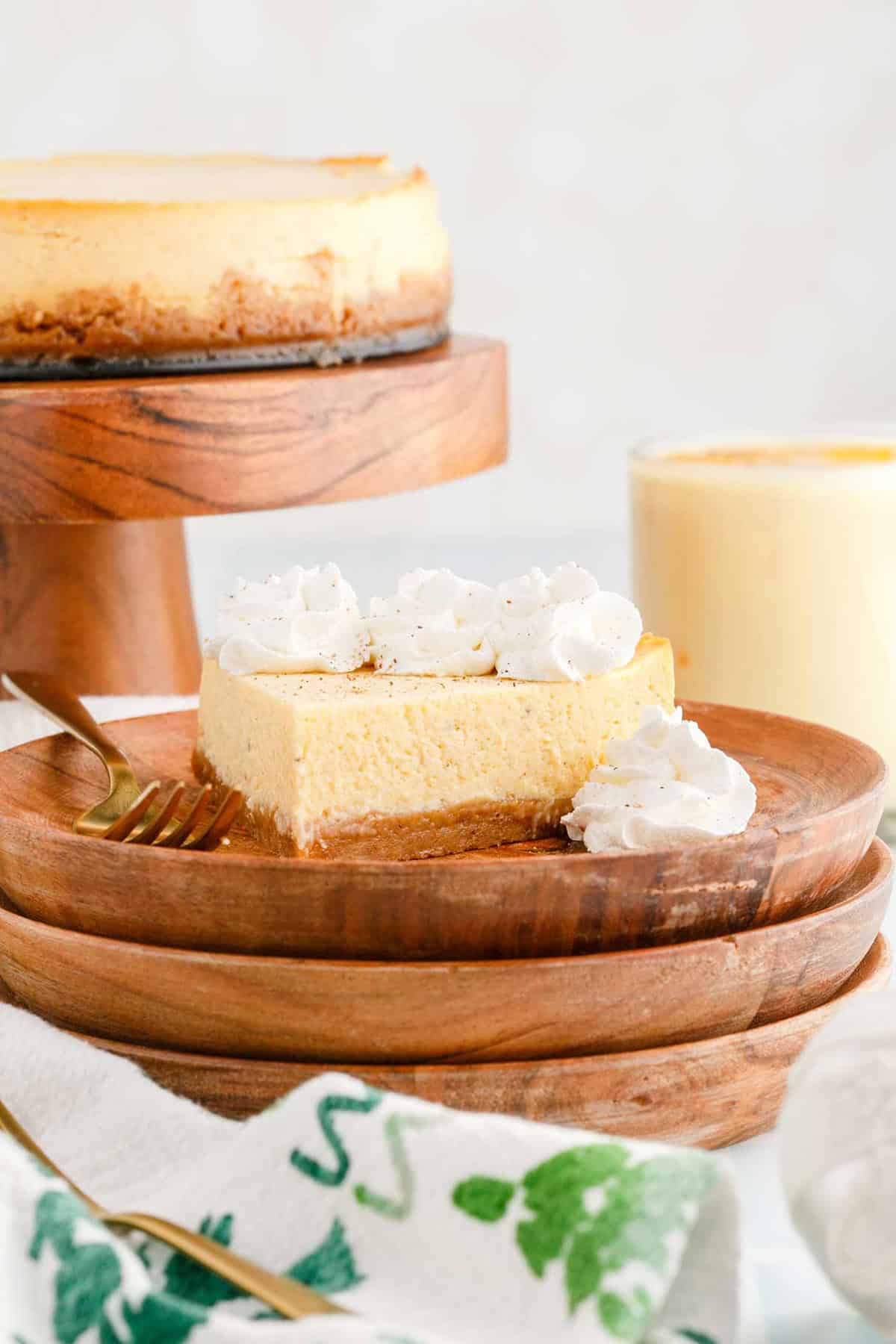 Eggnog Cheesecake Slice With Whipped Cream and Fork