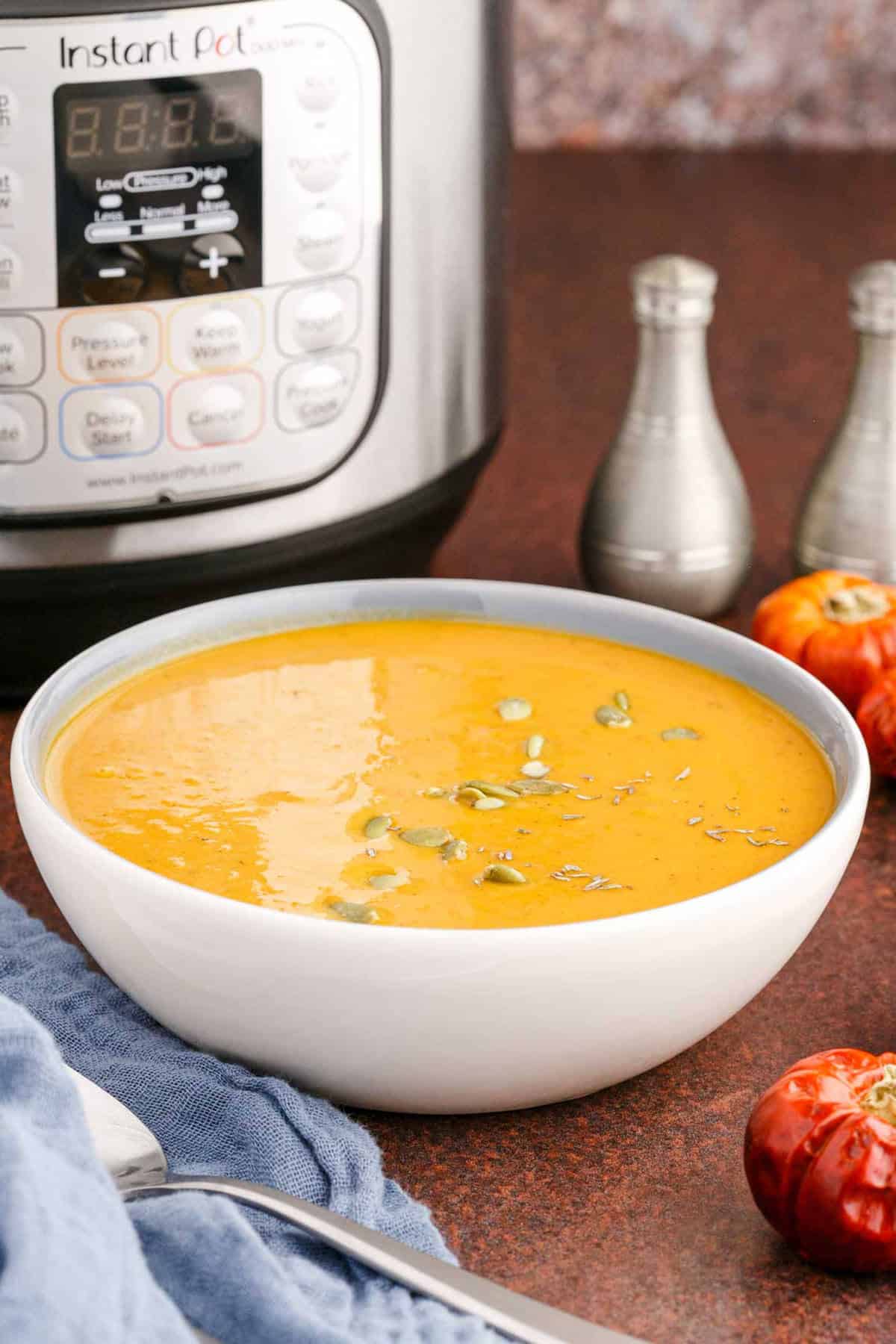 Instant Pot Pumpkin Soup in a Bowl Topped Pumpkin Seeds