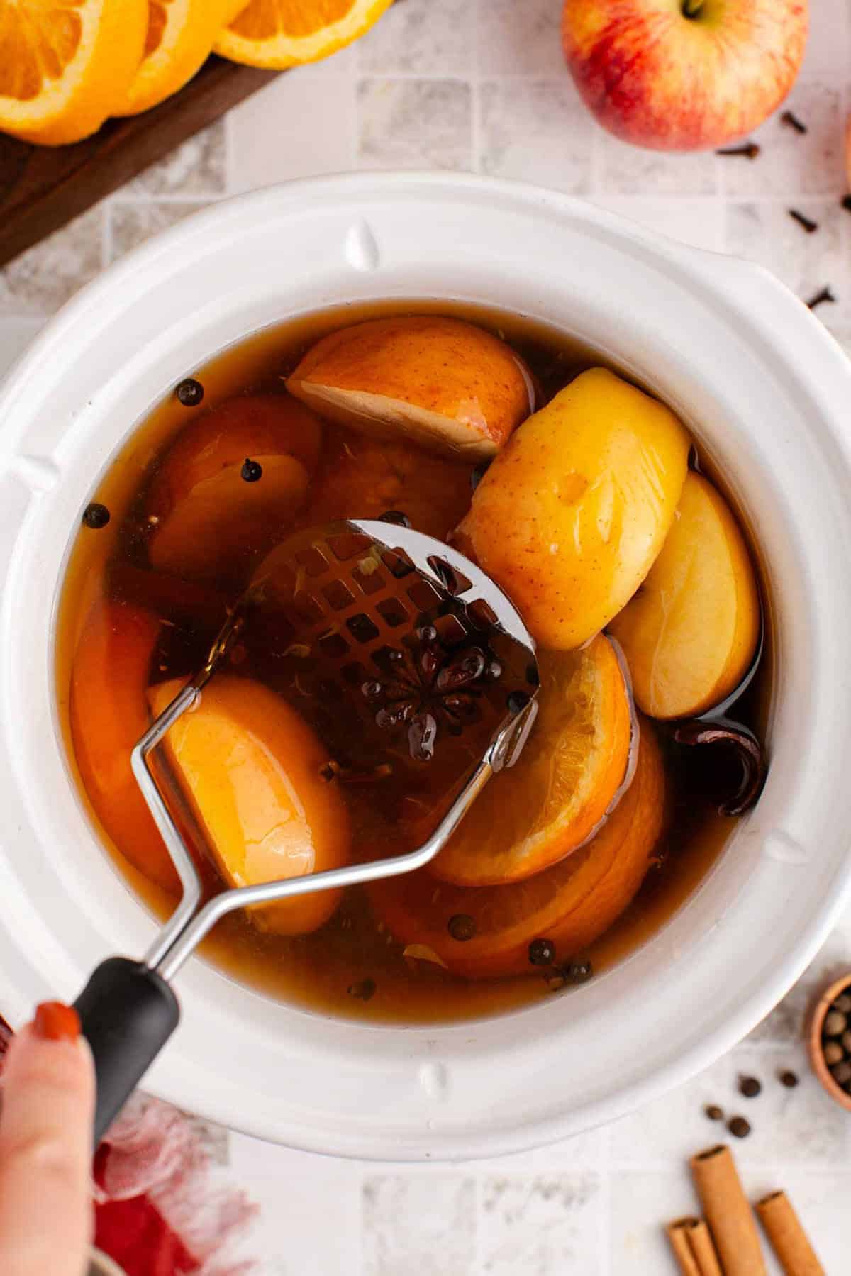 Spiked Apple Cider Crockpot with Masher