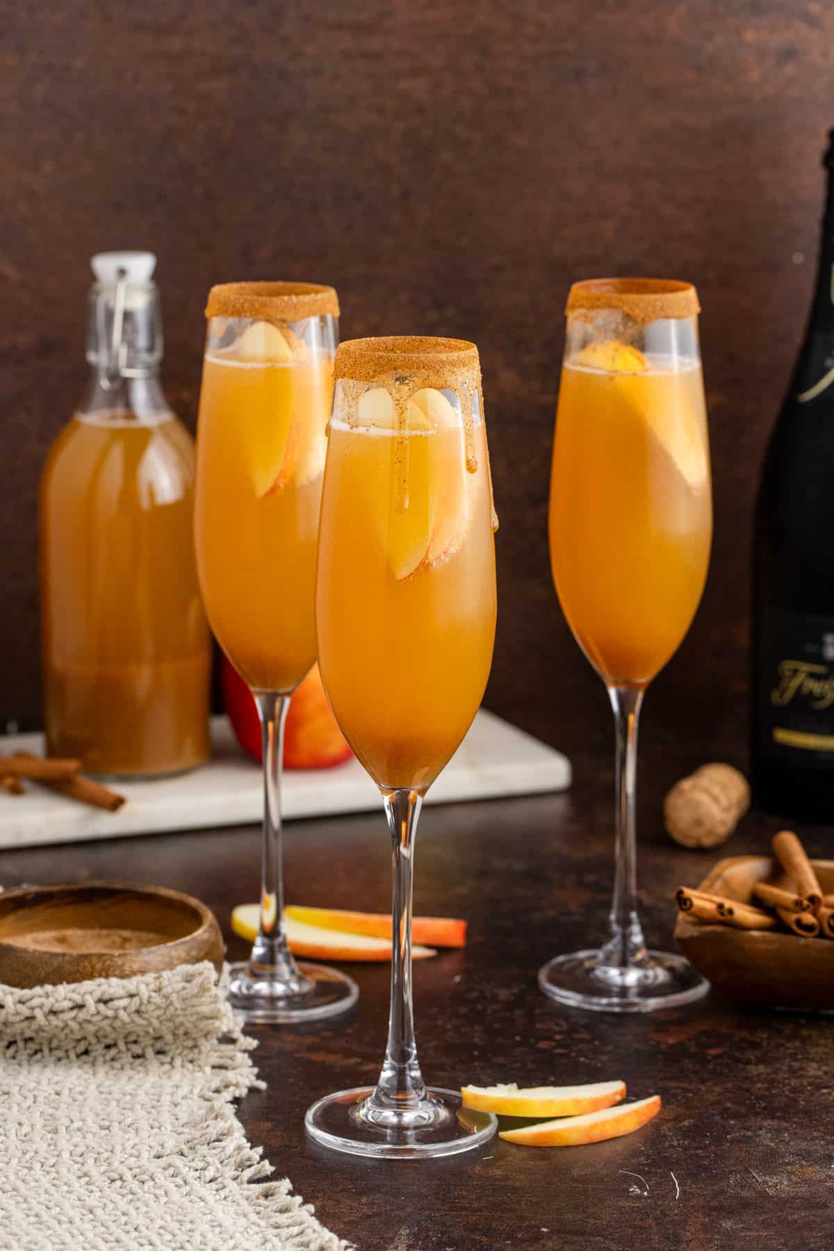 Apple Cider Mimosa in Champagne Flutes rimmed with Cinnamon Sugar