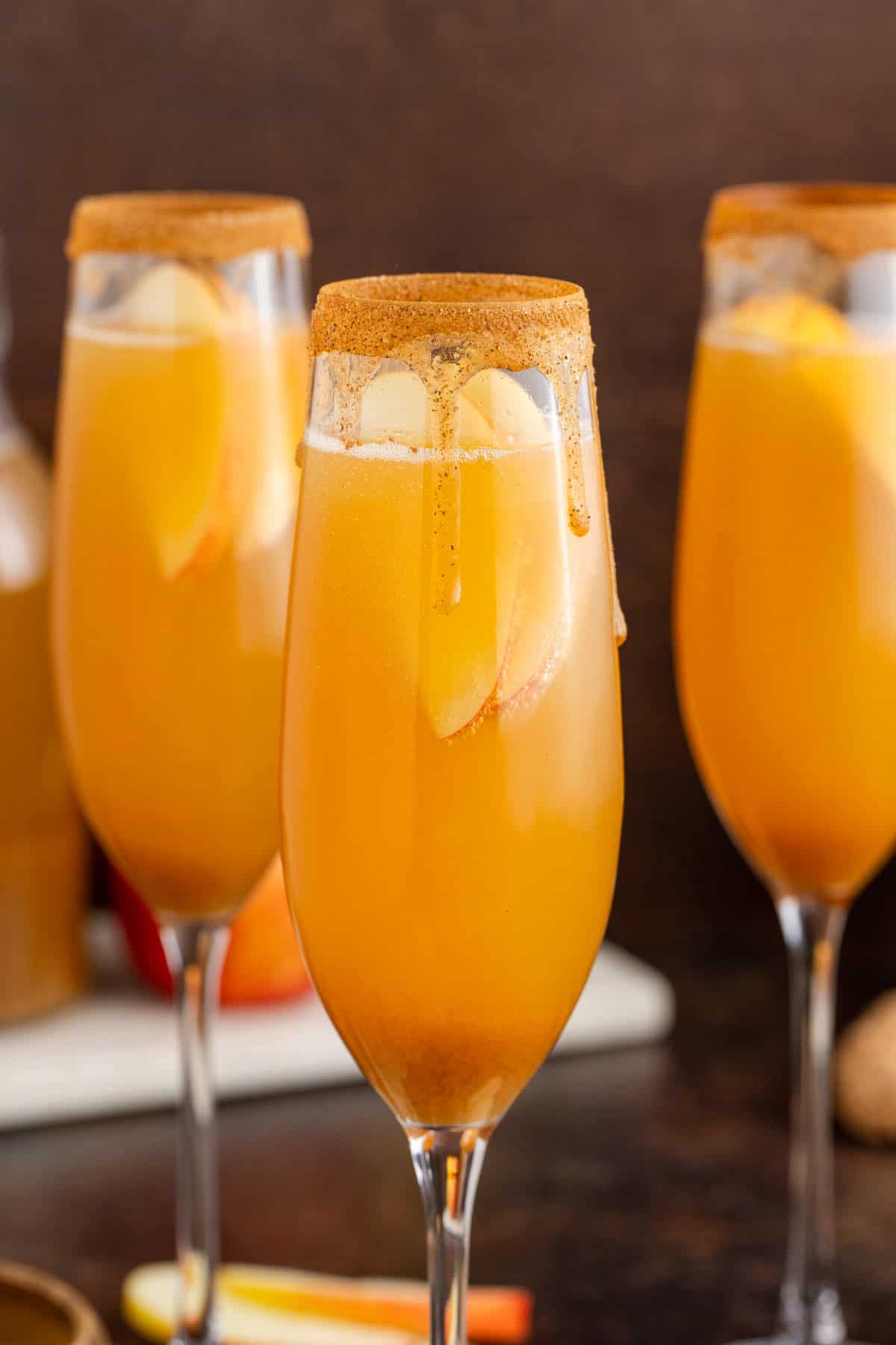 Apple Cider Mimosas in Cinnamon Sugar Rimmed Champagne Flutes