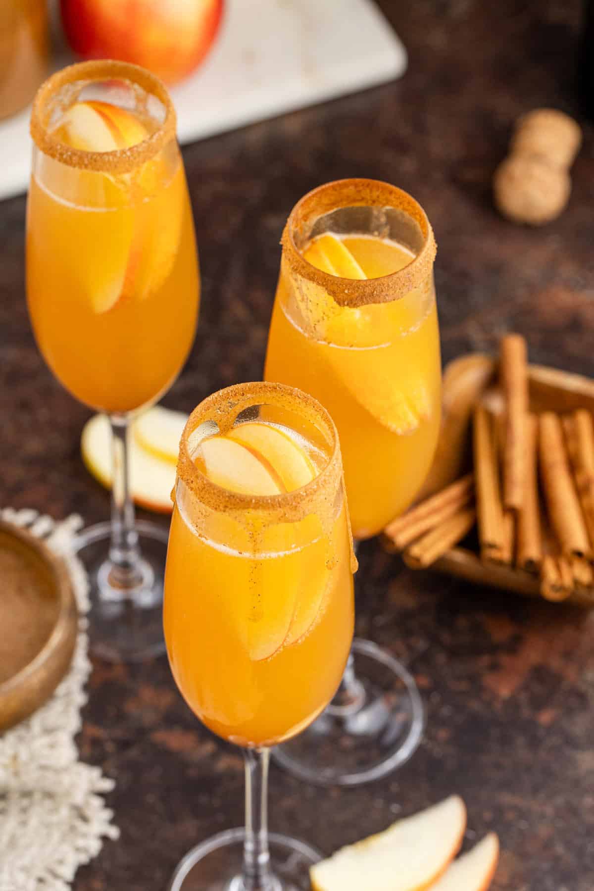 Apple Cider Mimosas in Cinnamon Sugar Rimmed Champagne Flutes