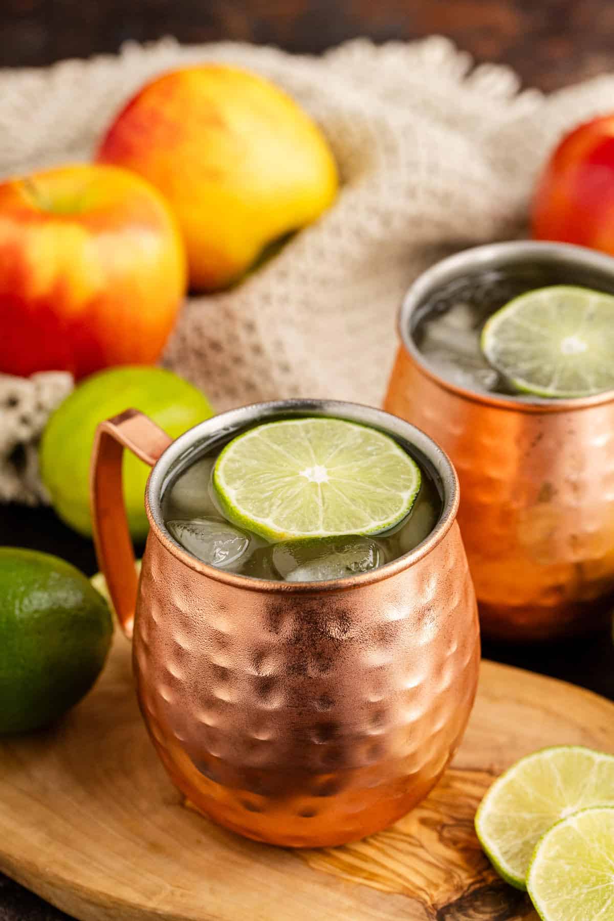 Apple Cider Moscow Mule in Glasses with Lime Garnish