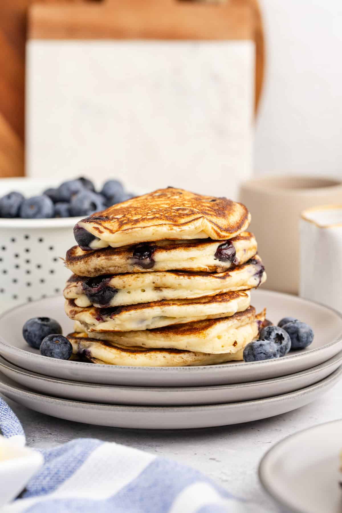 Blueberry Buttermilk Pancakes Stacked on a Plate