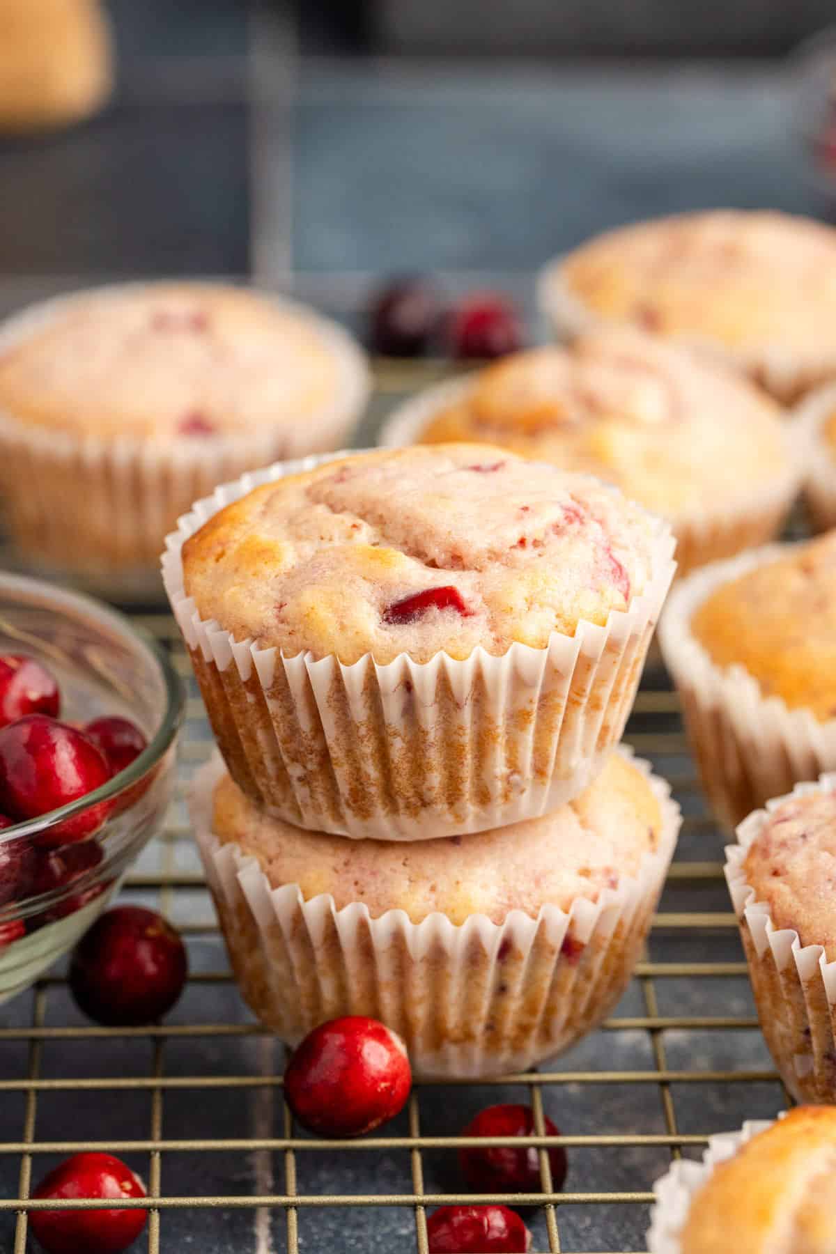 Cranberry Sauce Muffins Stacked on Cooling Rack