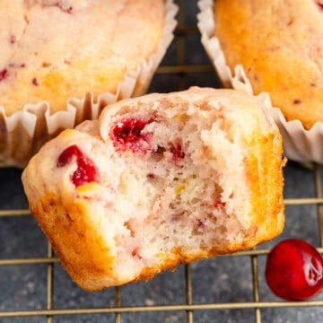 Cranberry Sauce Muffins on Cooling Rack with a Bite Taken