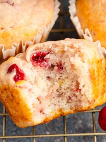 Cranberry Sauce Muffins on Cooling Rack with a Bite Taken