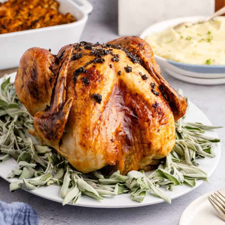 Herb Butter Turkey Cooked On a Platter with Fresh Sage