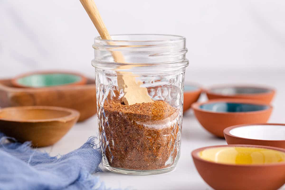 Moroccan Spice Blend in a Jar with a Spoon