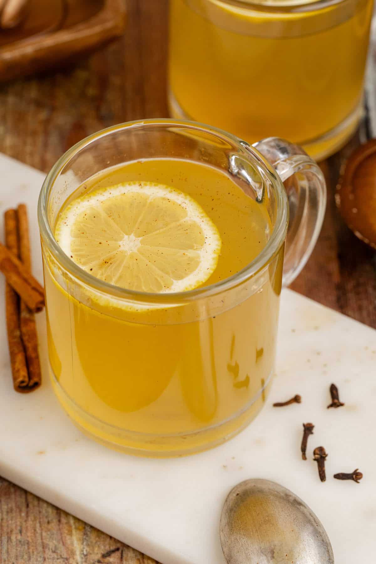 Old Fashioned Hot Toddy in Mug with a Lemon Round