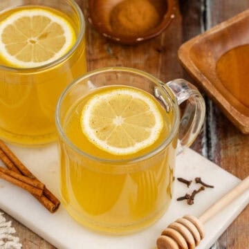 Old Fashioned Hot Toddy in Mug with a Lemon Round