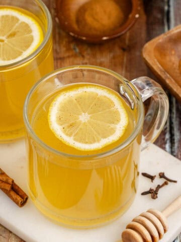 Old Fashioned Hot Toddy in Mug with a Lemon Round