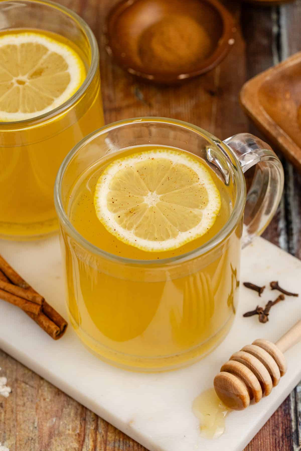 Old Fashioned Hot Toddy in Mugs with a Lemon Round