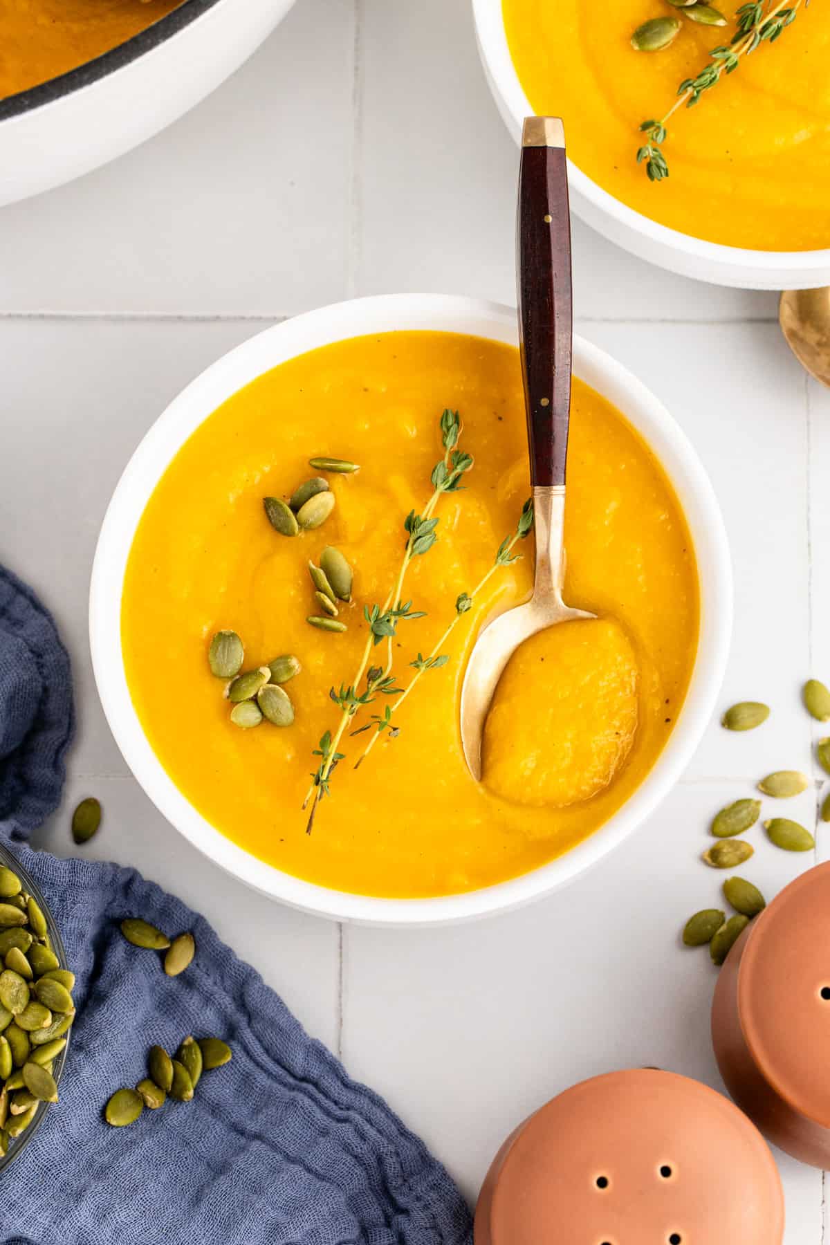 Roasted Butternut Squash and Garlic Soup with Spoon in a Bowl