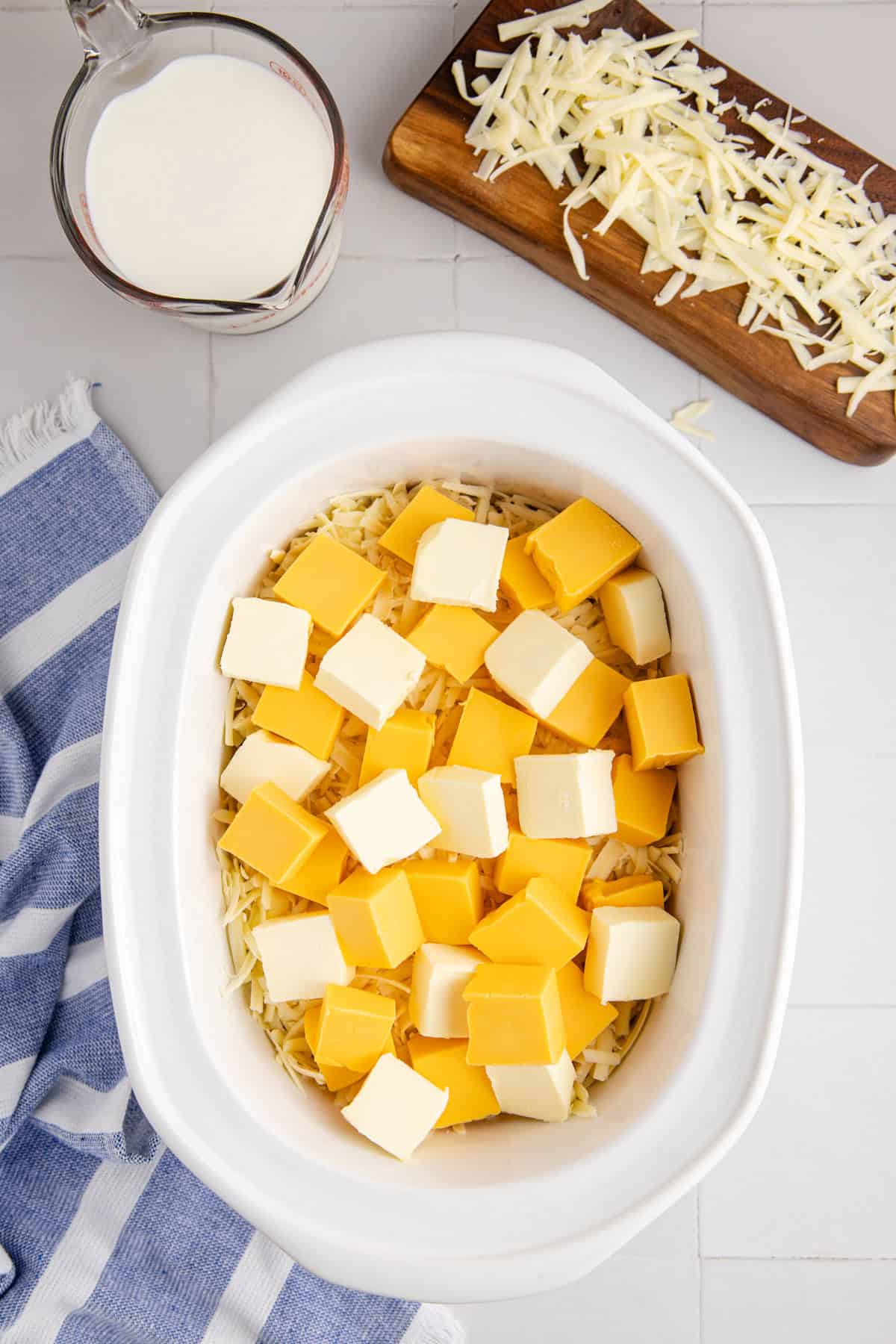 Slow Cooker Mac and Cheese Velveeta Being Made in Base