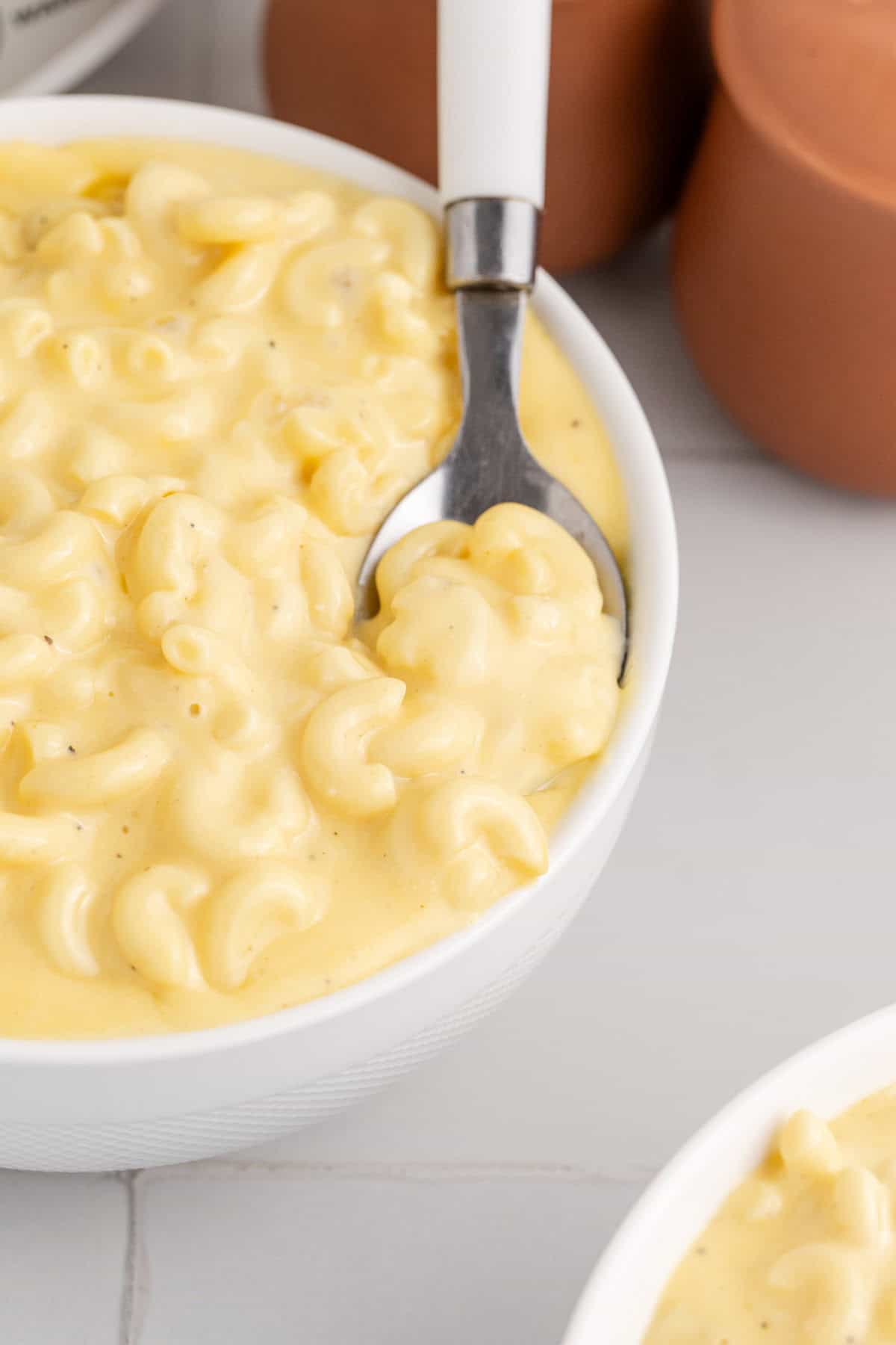 Slow Cooker Mac and Cheese Velveeta in a Bowl with a Spoon