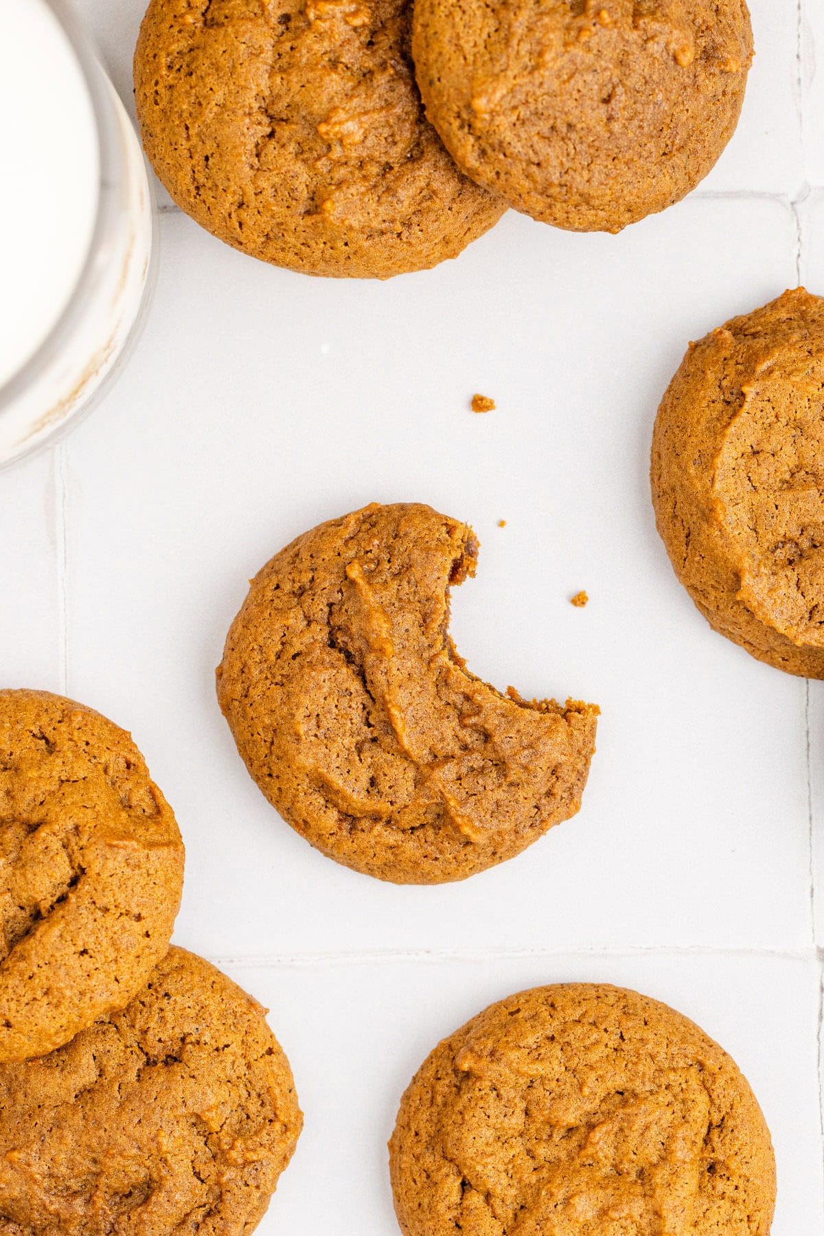 Spicy Chewy Ginger Molasses Cookies on Counter with Bite Taken