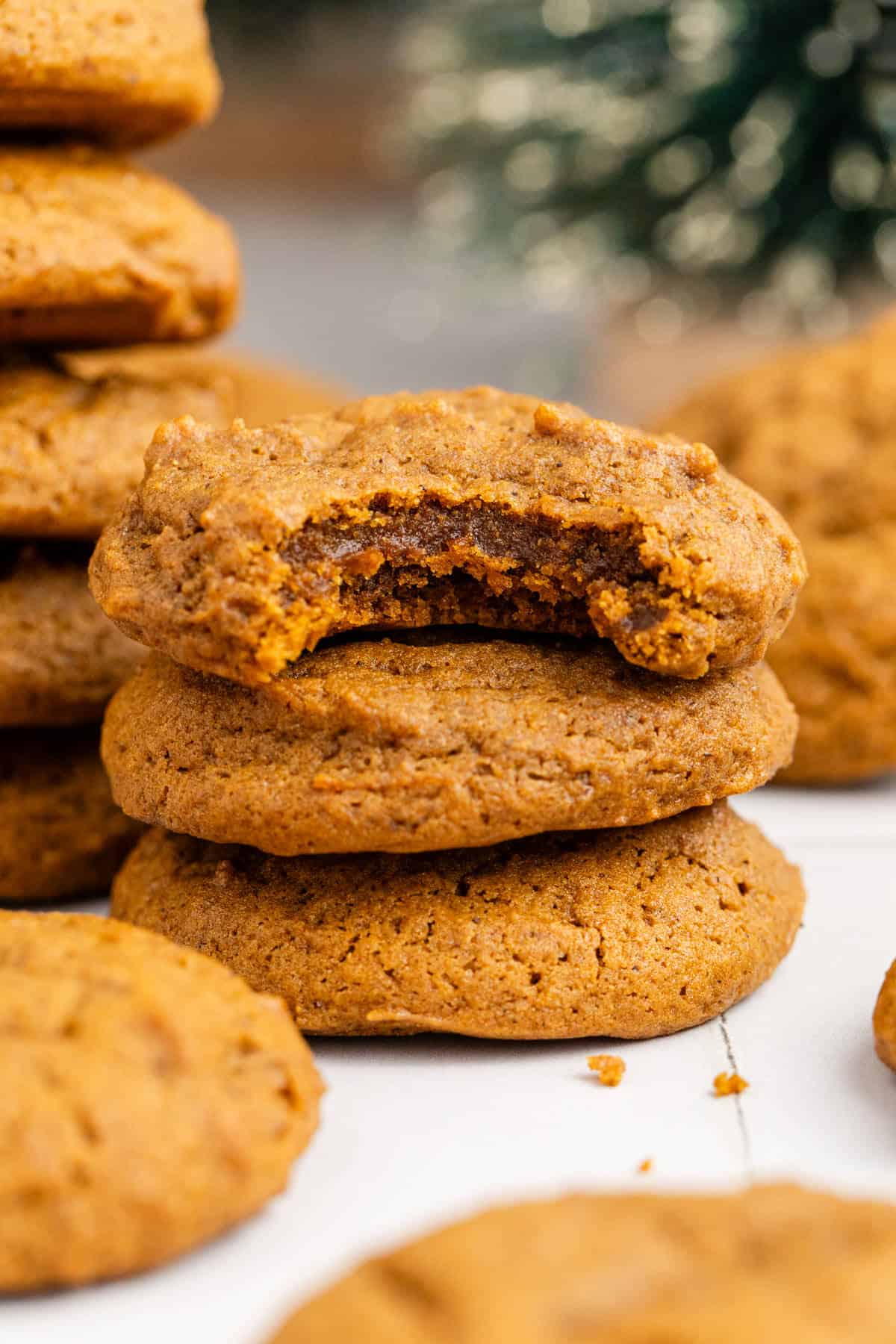 Spicy Chewy Ginger Molasses Cookies Stacked with a Bite Taken