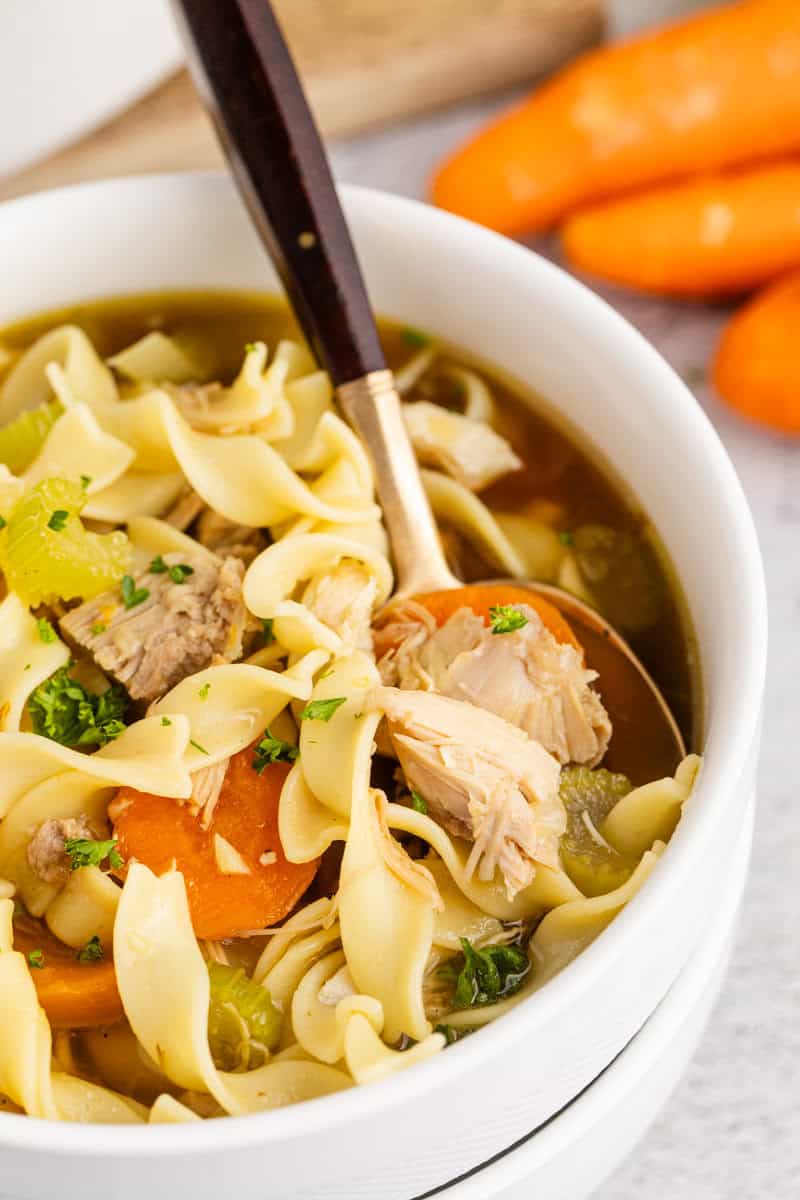 Turkey and Veg Soup in a Bowl with a Spoon