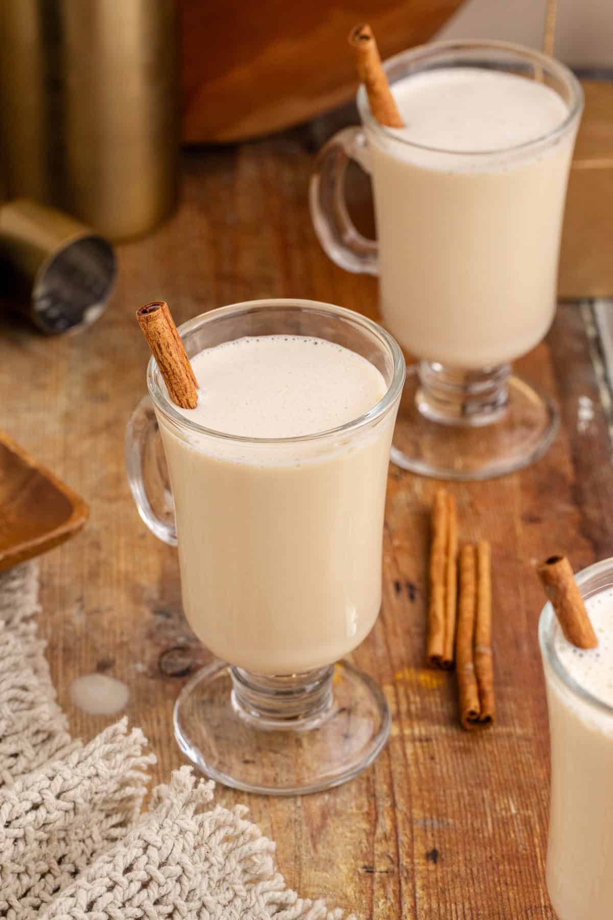 Baileys and Eggnog in a Cocktail glass with a Cinnamon Stick