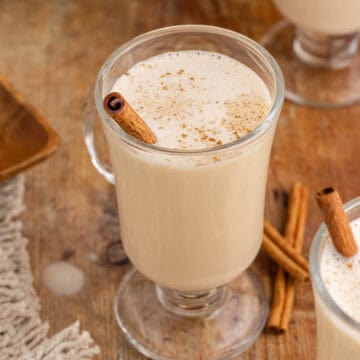 Baileys and Eggnog in a Cocktail glass with a Cinnamon