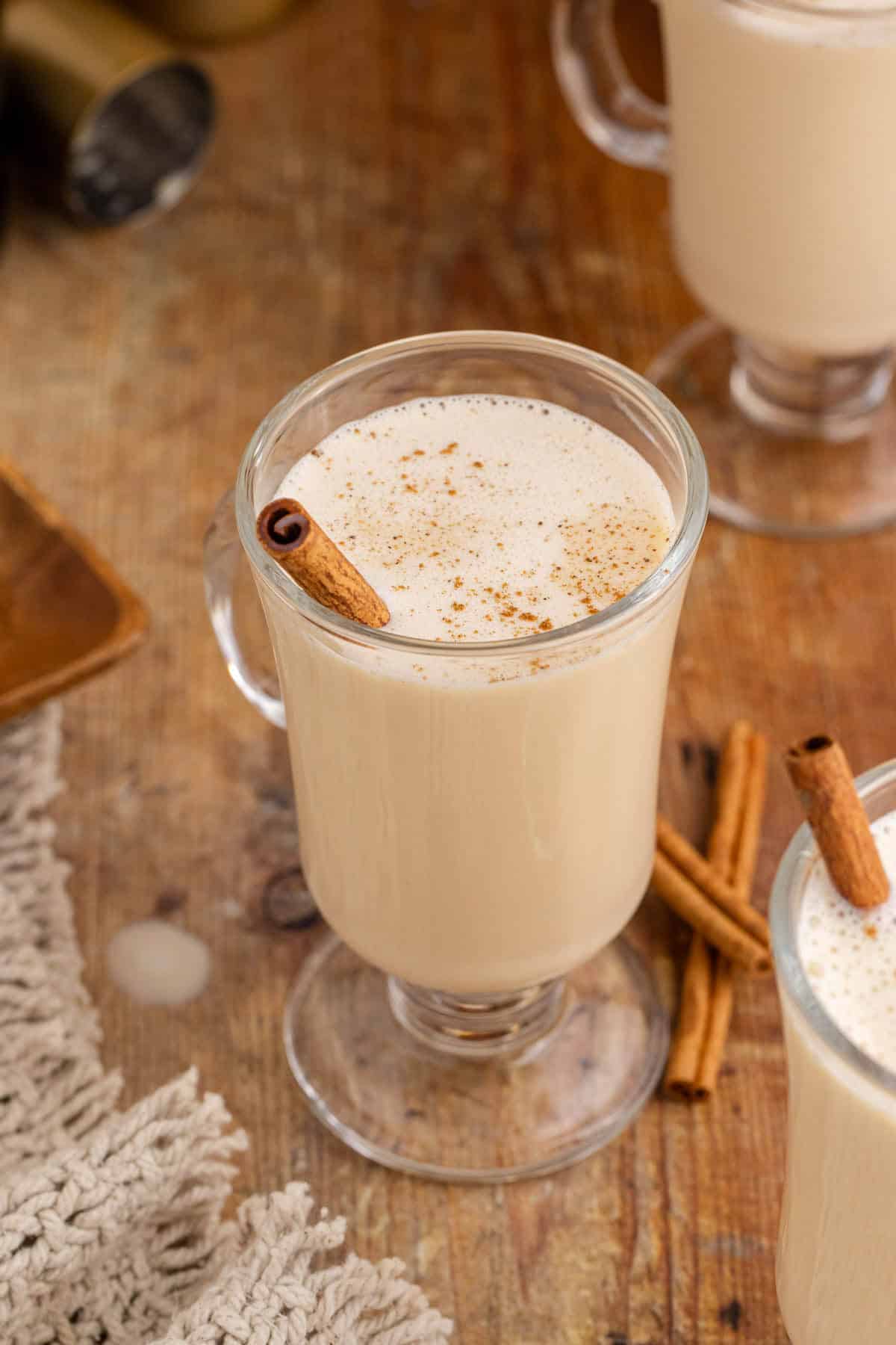 Baileys and Eggnog in a Cocktail glass with a Cinnamon Stick