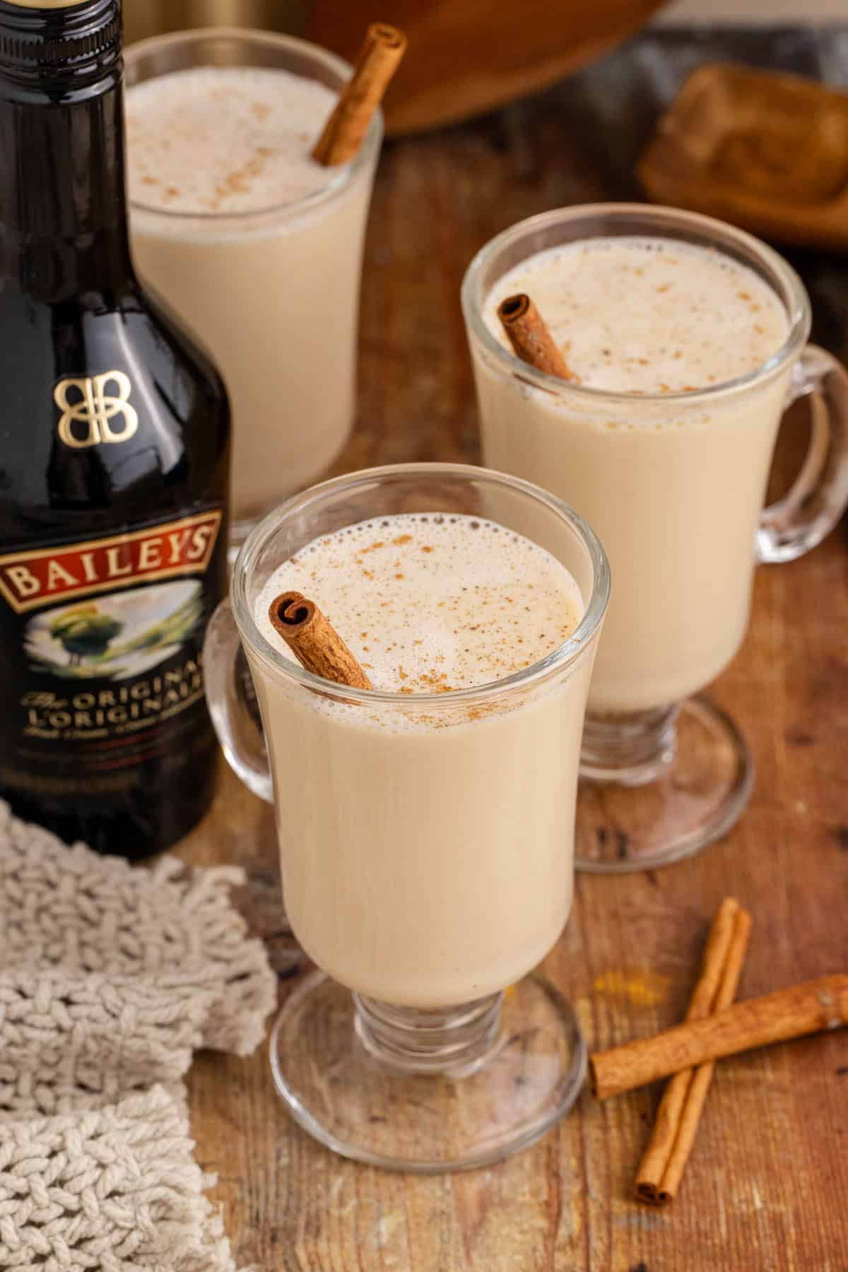 Baileys and Eggnog in a Cocktail glasses with Cinnamon Sticks