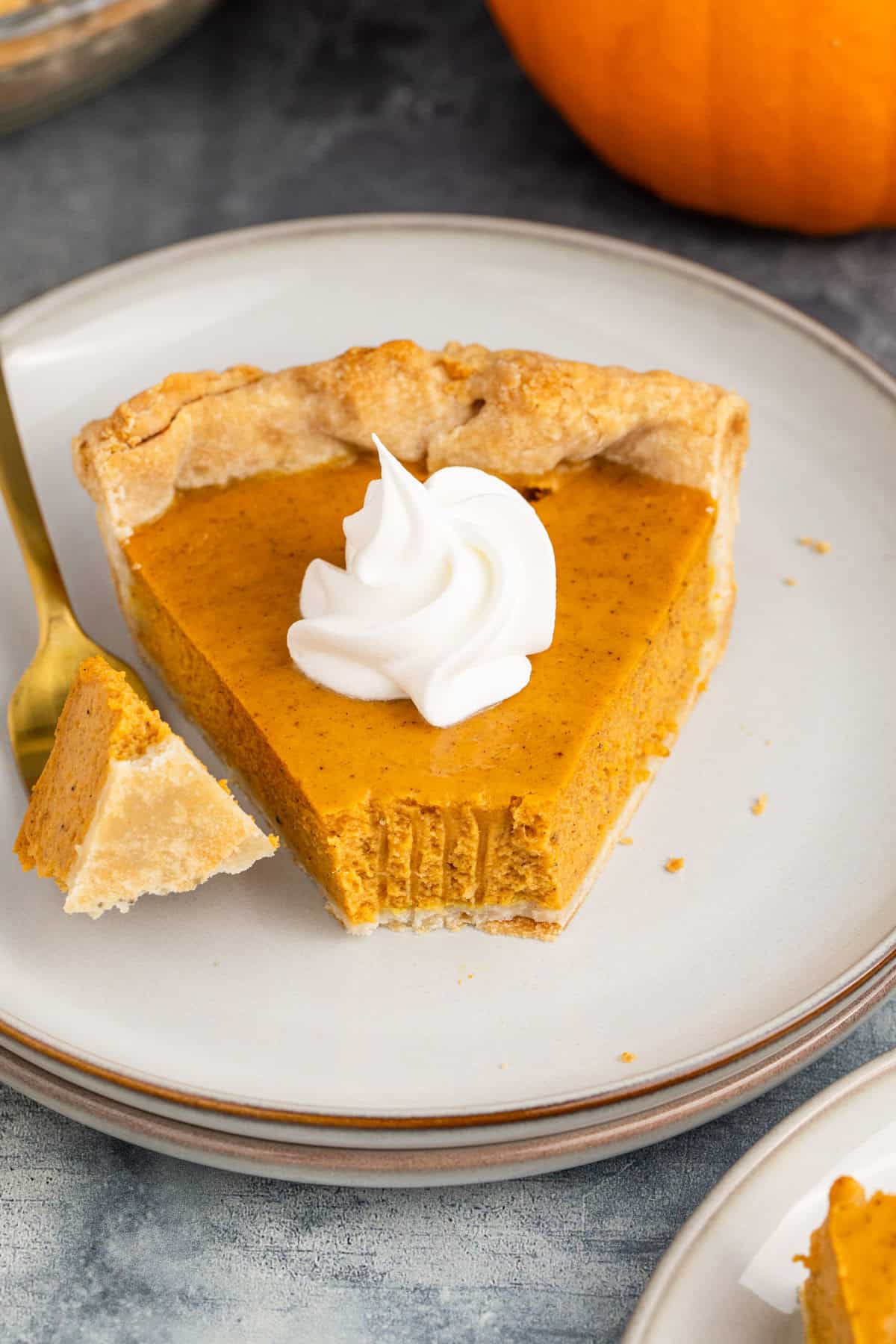 Pumpkin Pie Using Sweetened Condensed Milk on Plate with Whipped Cream