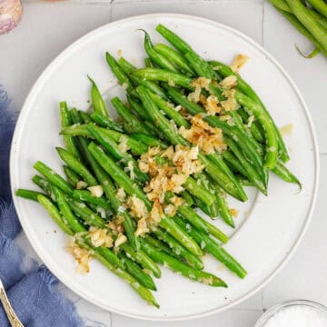 Sautéed Green Beans with Shallots and Garlic on a Platter