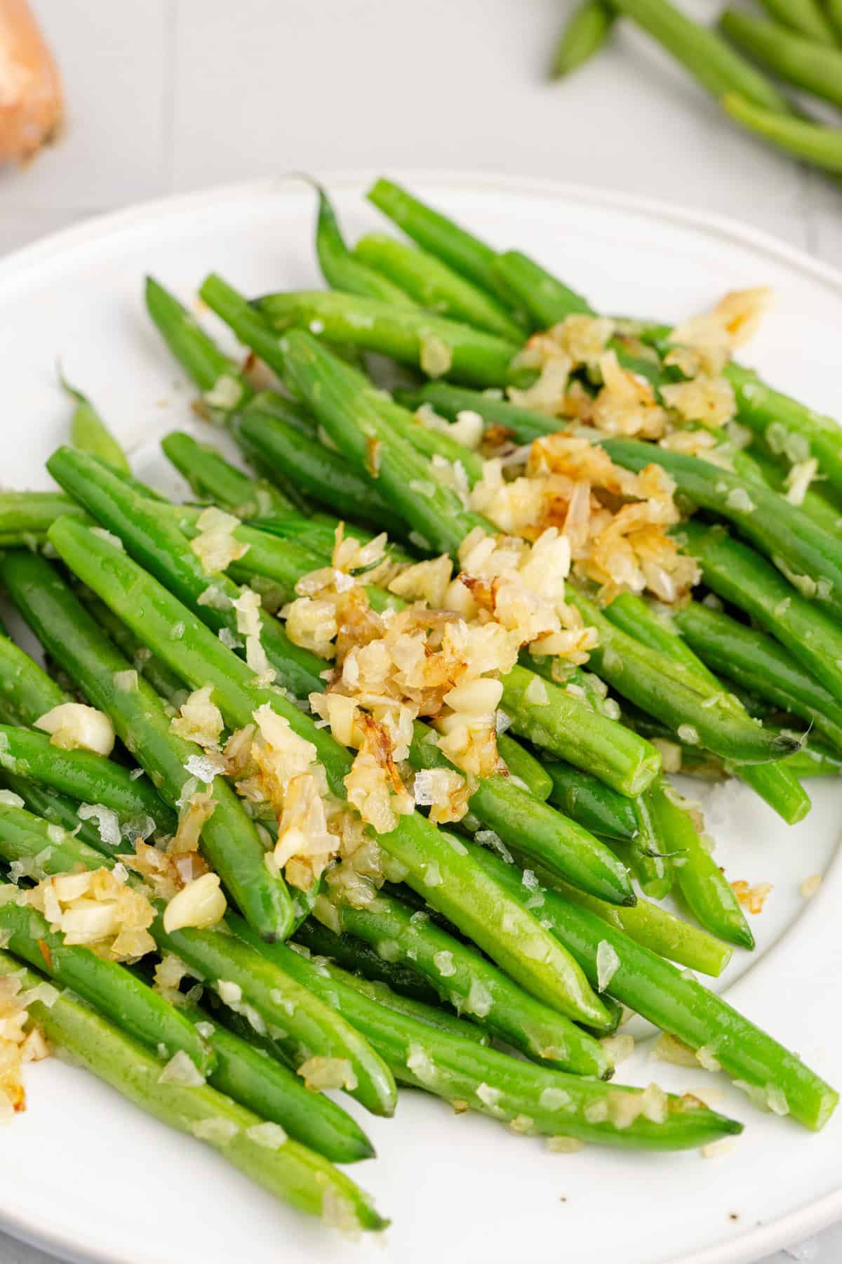 Sautéed Green Beans with Shallots and Garlic on a Platter