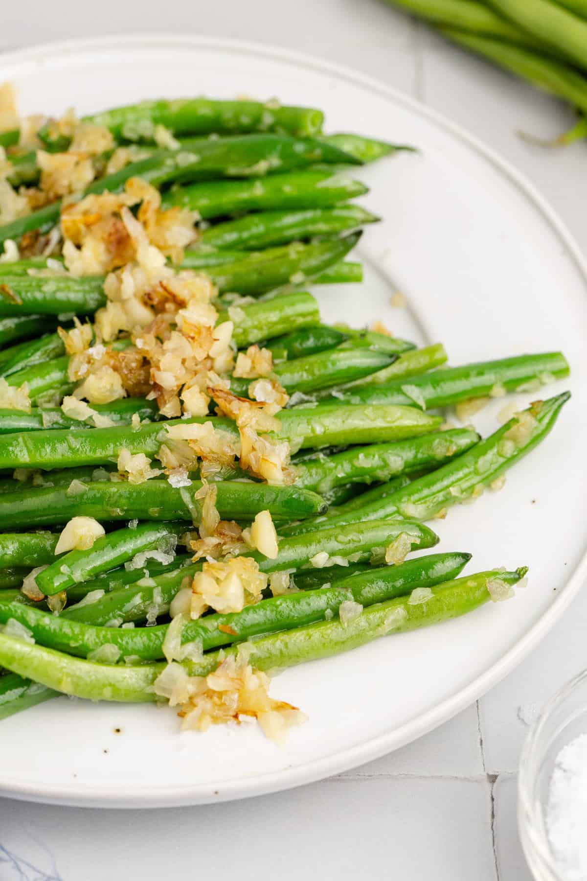 Sautéed Green Beans with Shallots and Garlic on a Platter