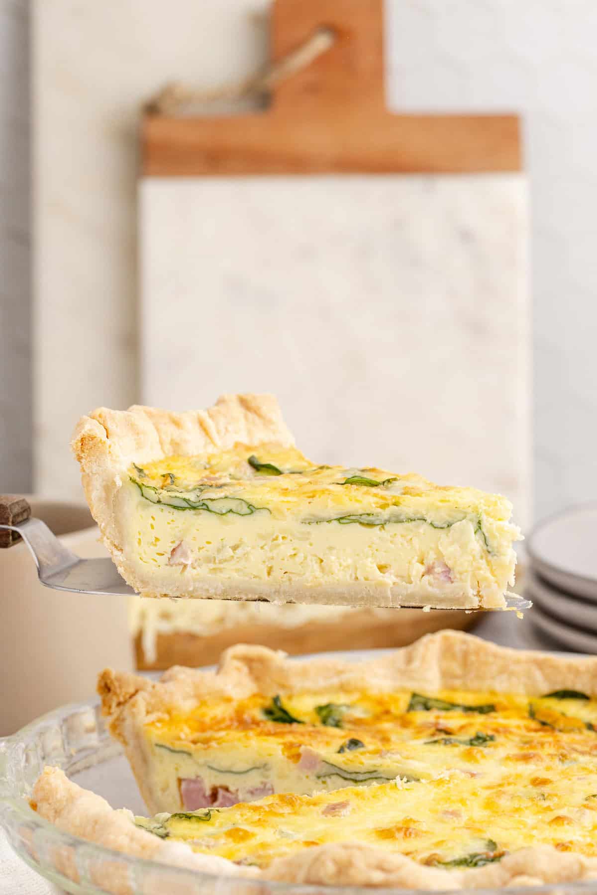 Spinach Ham Quiche Lorraine Slice on a Pie Cutter