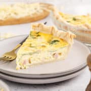 Spinach Ham Quiche Lorraine Slice on a Plate with Fork