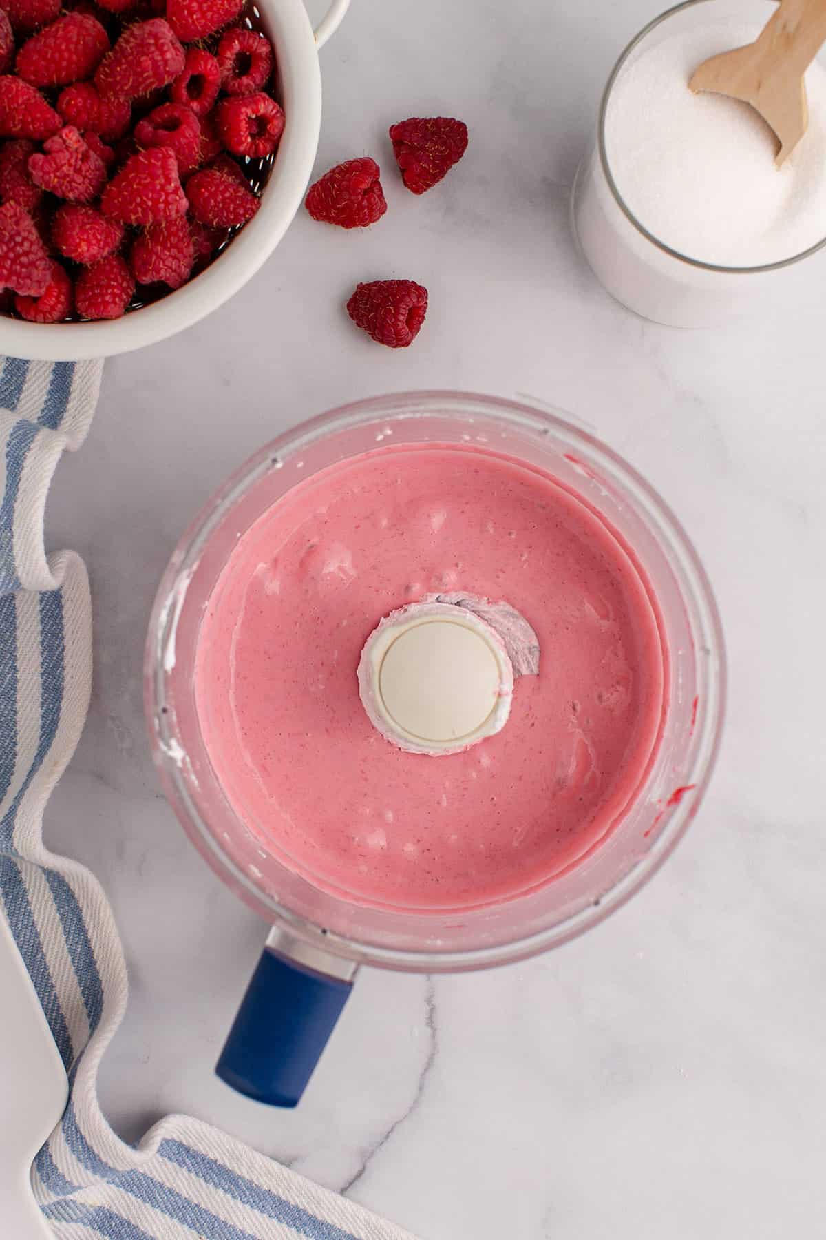 Raspberry Mousse without Gelatin in a Bowl with Raspberries Besides