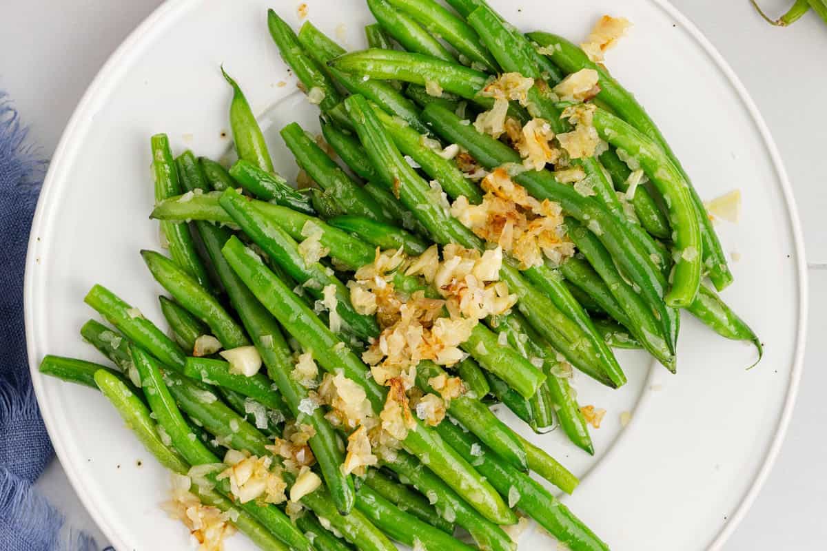 Sautéed Green Beans with Shallots and Garlic on a Platter