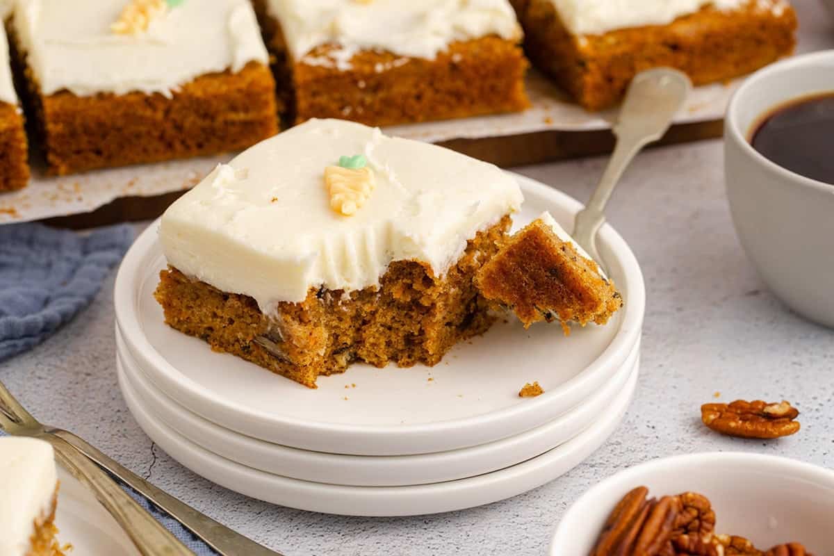 Carrot Sheet Cake slice and fork on the plate with a bite on it