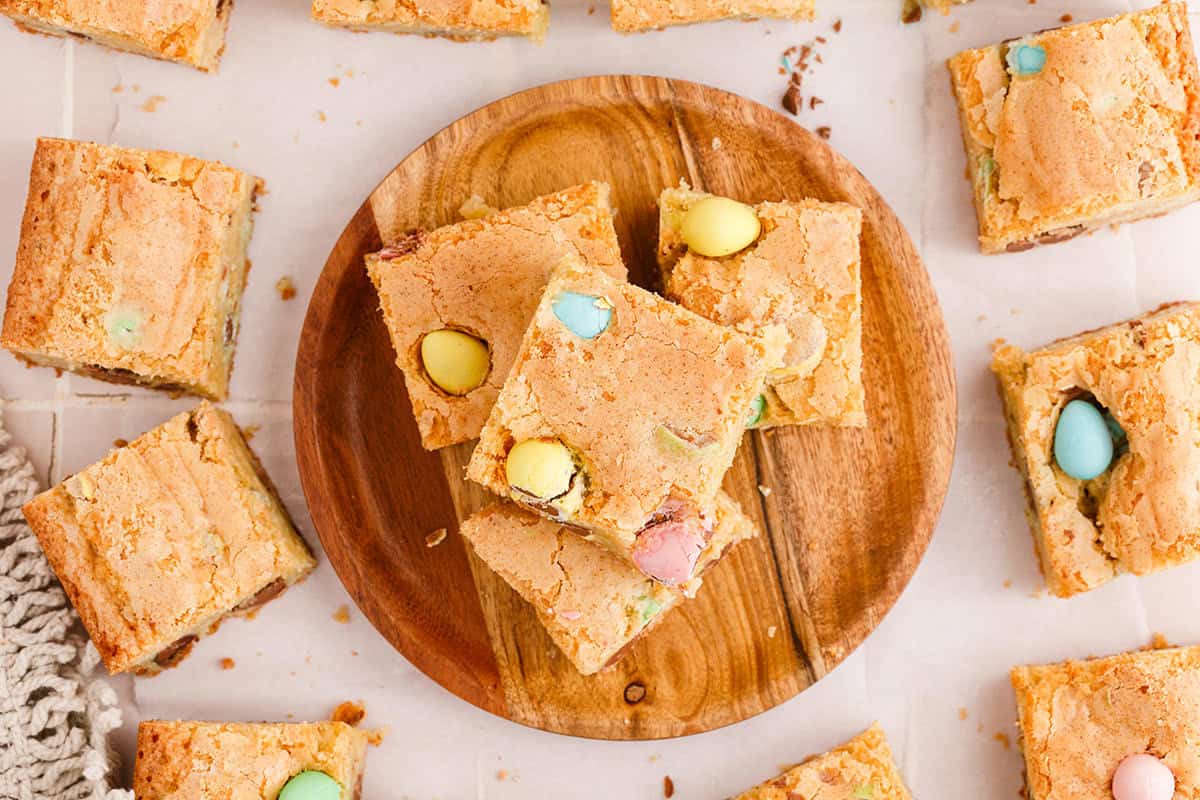 Easter Blondies with Mini Eggs Stacked Up on a Plate
