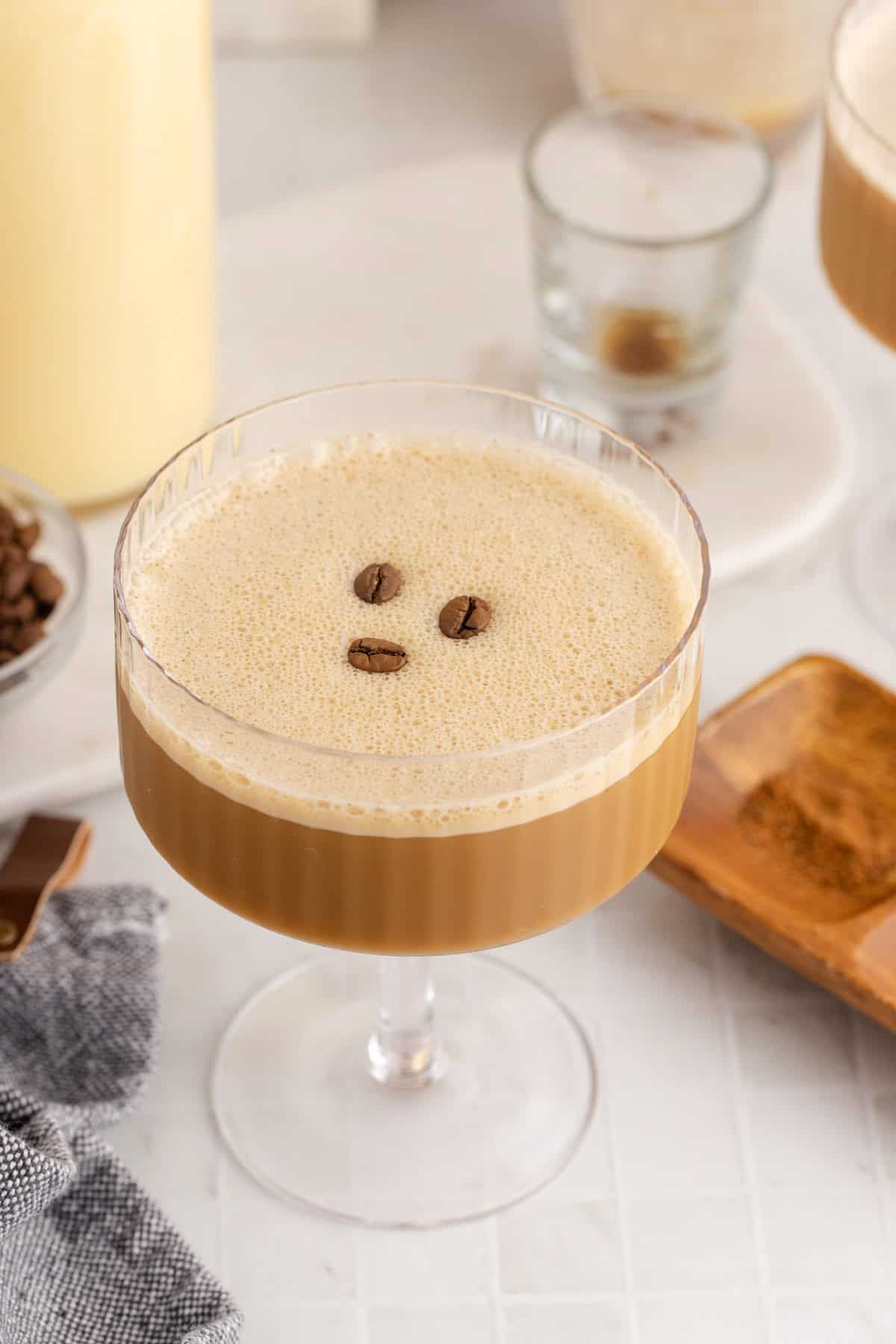 Eggnog Espresso Martini in a Coupe Glass with Coffee Beans