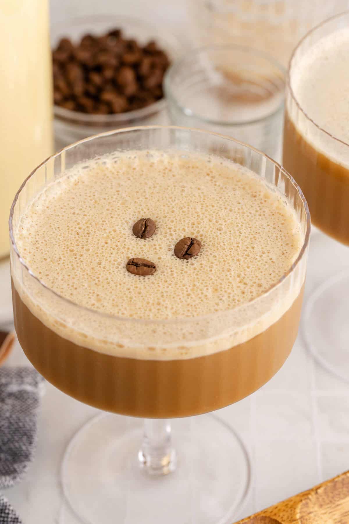 Eggnog Espresso Martini in a Coupe Glass with Coffee Beans