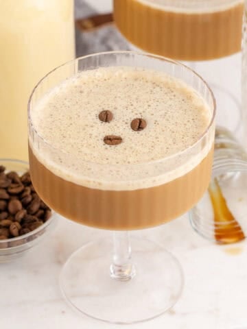 Eggnog Espresso Martini in a Coupe Glass with Coffee Beans
