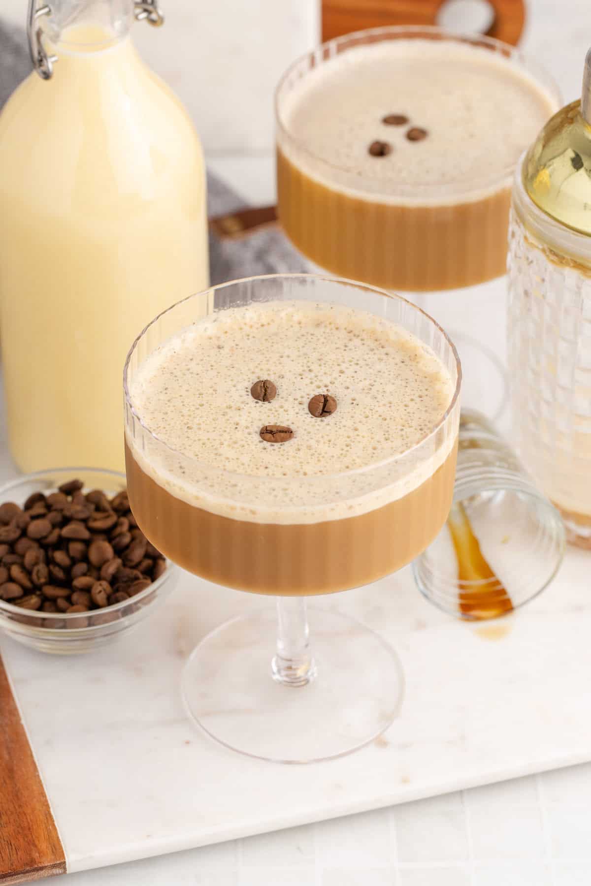 Eggnog Espresso Martini in a Coupe Glass with Coffee Beans