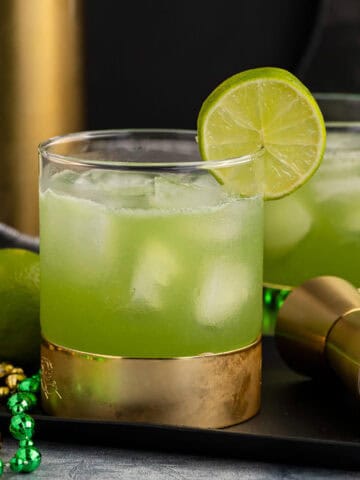 Shamrock Sour in Glasses and Lime Garnish