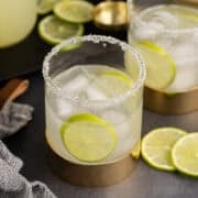 Margarita Mix in background margaritas in glasses close up