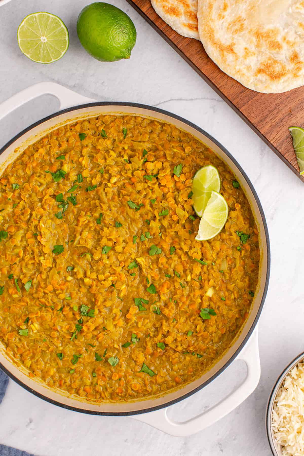 Coconut Milk Curry Lentils in a pan with cilantro and lime