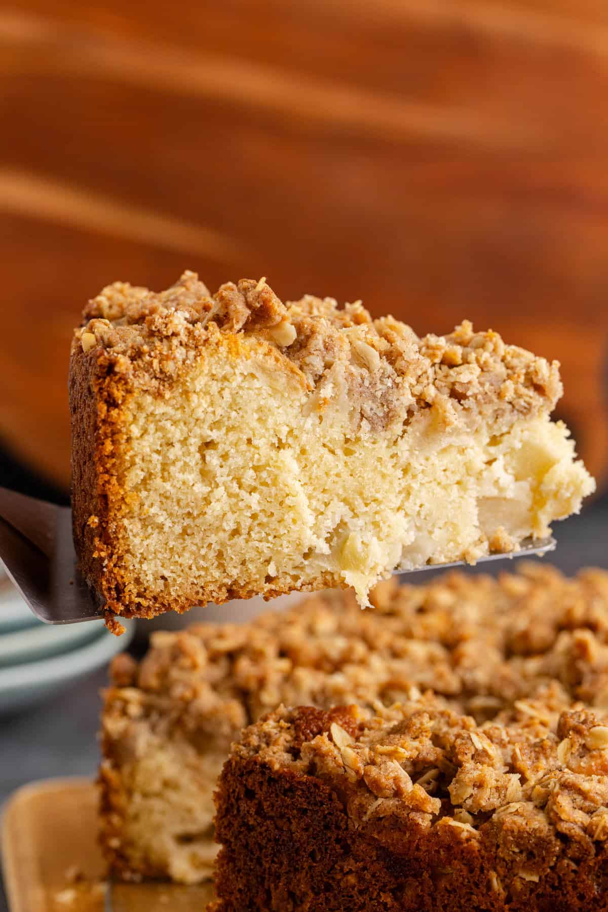 Apple Coffee Cake slice being taken out of cake