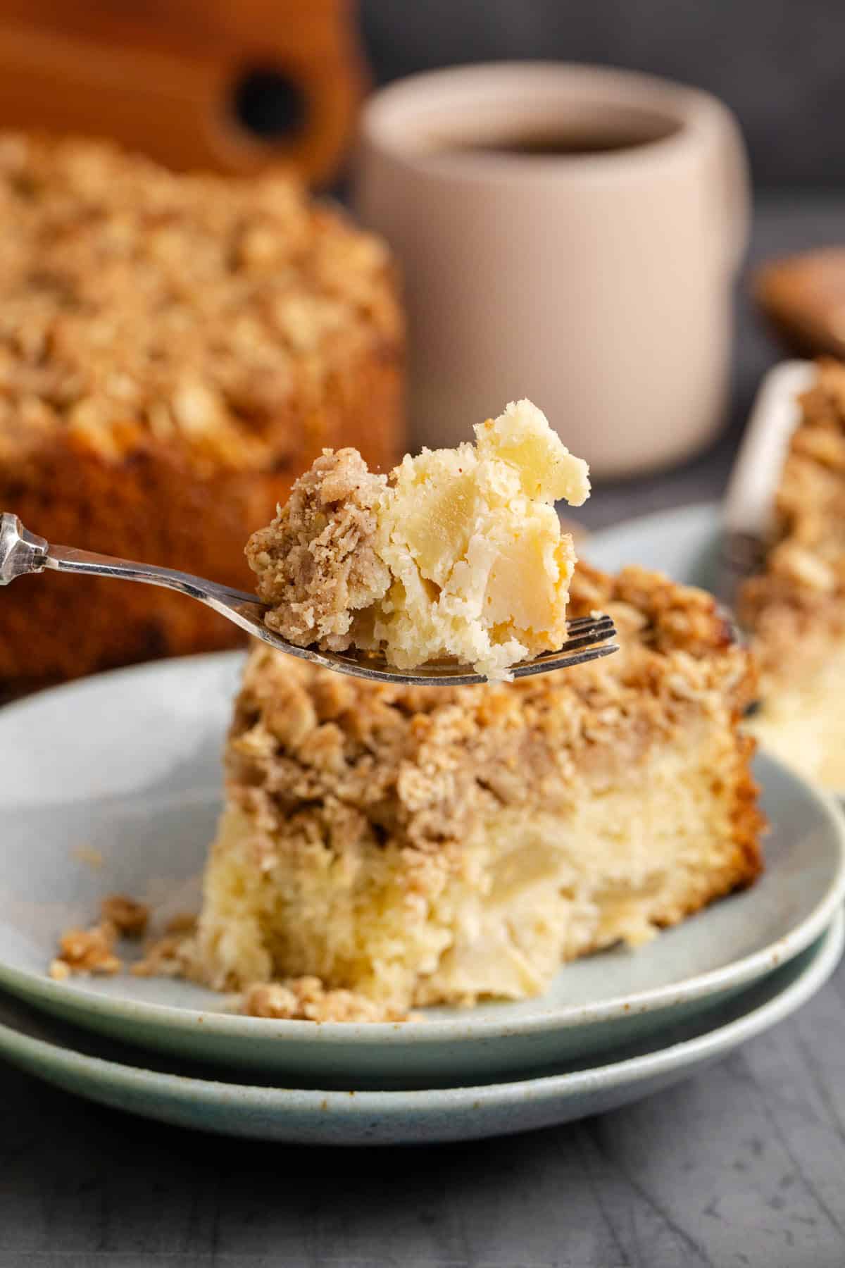 Apple Coffee Cake with a close up bite on a fork