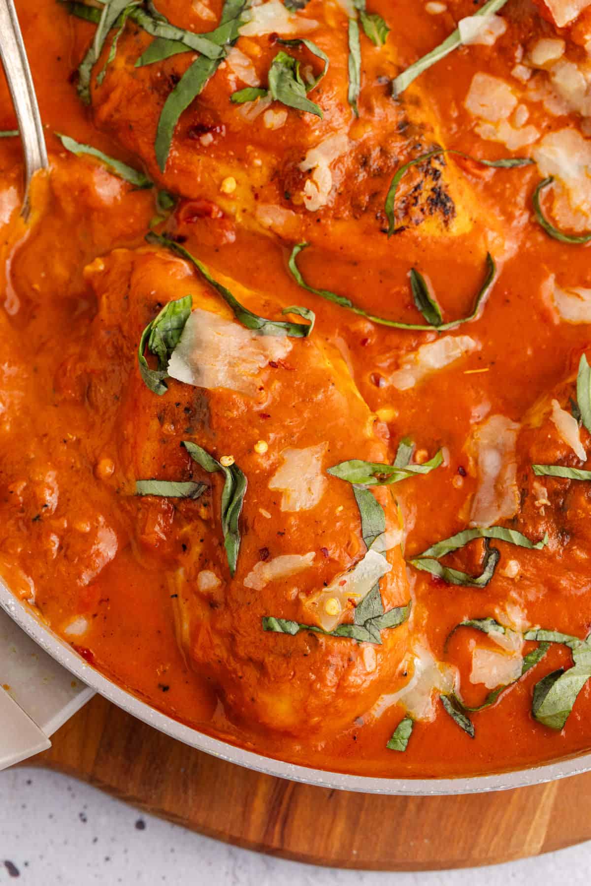 Tomato Basil Chicken in a pan after cooking close up